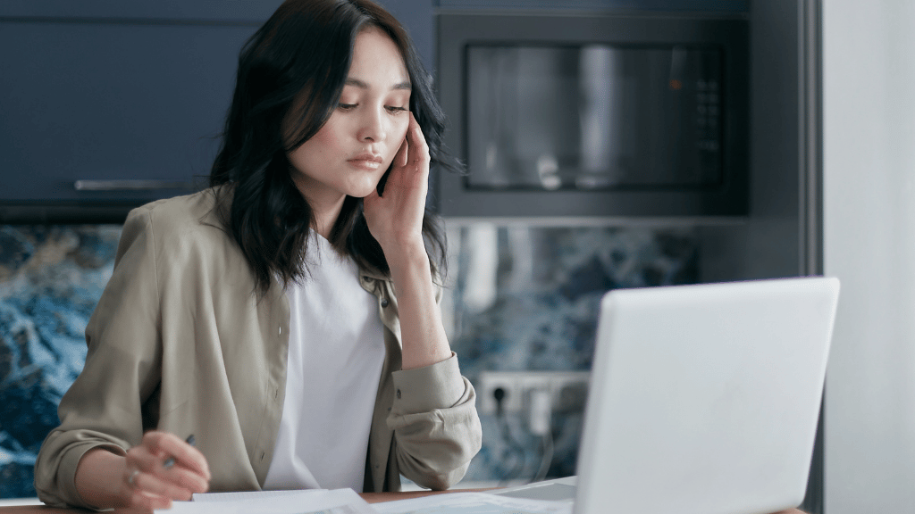 Adult feeling emotionally overwhelmed while managing work responsibilities and questioning whether therapy may help.